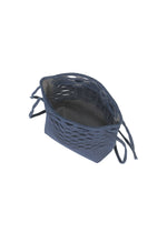 A navy blue, rectangular fabric basket from GOOD GOODS ISSEY MIYAKE's MOKKO WASHI series, featuring woven sides and four tied corners, is displayed on a white background.