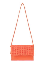 MOKKO WALE by GOOD GOODS ISSEY MIYAKE: an orange woven shoulder bag featuring a rectangular shape, long thin strap, and textured grid-like flap. Shown against a plain white background. - WARM ORANGE×ROSE PINK （no.33）