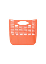 The MOKKO WALE by GOOD GOODS ISSEY MIYAKE is an orange tote bag with grid-like slits and an oval top handle, shown against a plain white background. - WARM ORANGE×ROSE PINK （no.33）