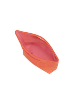 A small, orange fabric basket with raised sides and a boat-like shape from GOOD GOODS ISSEY MIYAKE’s MOKKO WALE, photographed on a white background.