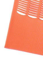 An orange MOKKO WALE sheet by GOOD GOODS ISSEY MIYAKE with horizontal slits and thin vertical two-color stripes, photographed at an angle on a white background.