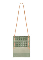 The MOKKO KNOT by GOOD GOODS ISSEY MIYAKE is a square, light green knit shoulder bag with visible stitching, a long tan rope strap, and a subtle MOKKO slit pattern, displayed on a white background. - JADE GREEN MIX （no.64）
