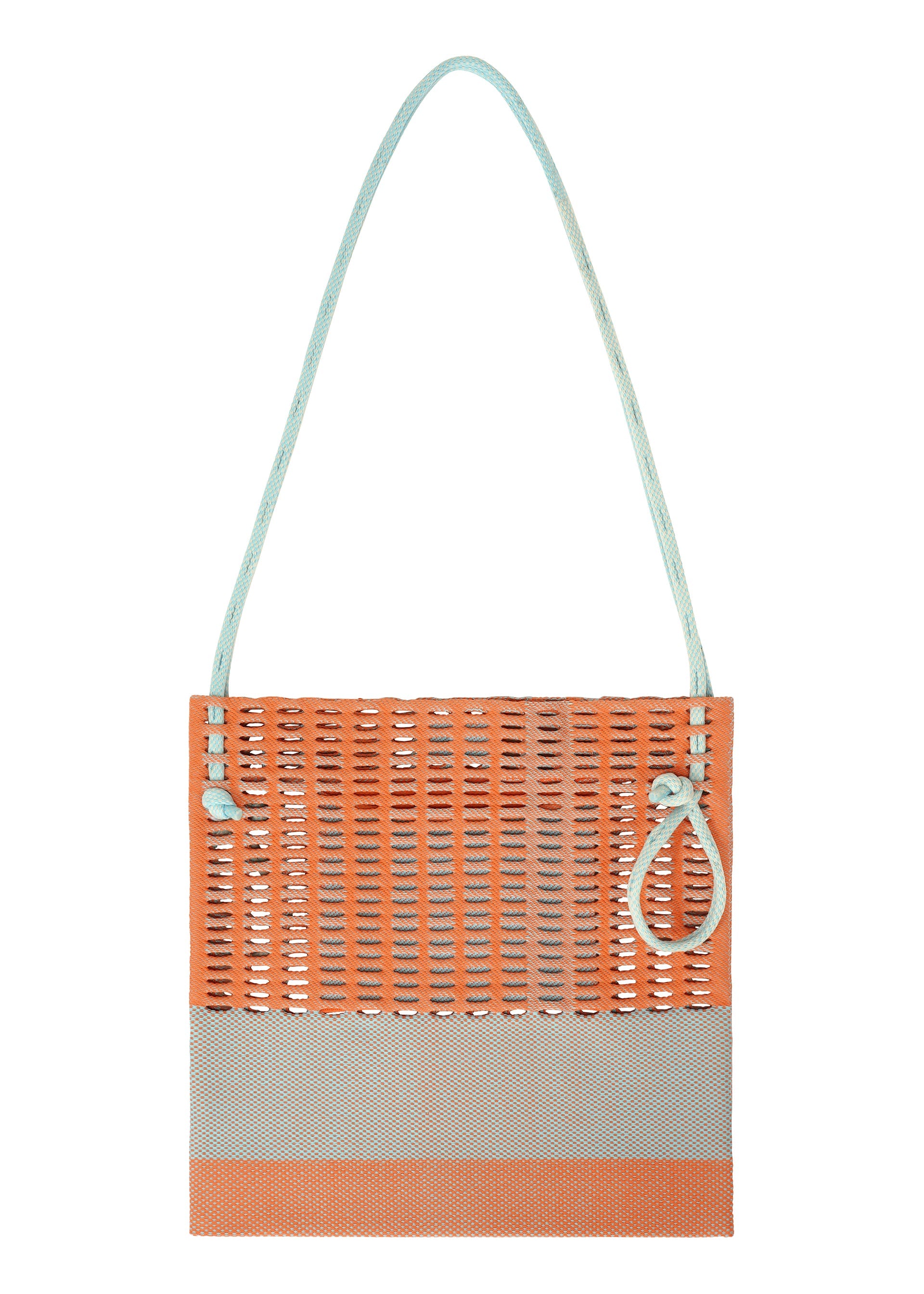Zoomed view The MOKKO KNOT by GOOD GOODS ISSEY MIYAKE is a rectangular knit tote with an orange upper, light gray base, pale blue handles, and a side loop. Its open, airy design reflects modern minimalism.