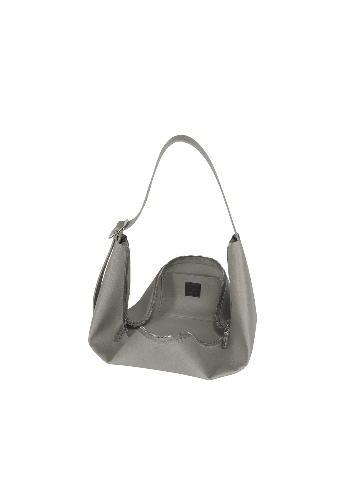 The LEAF by GOOD GOODS ISSEY MIYAKE is a gray suede-like shoulder bag with a single handle, shown open to reveal an empty interior and visible zipper against a plain white background. view 5 of 8