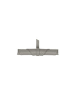 The LEAF by GOOD GOODS ISSEY MIYAKE is a rolled-up gray suede-like item, secured with a strap and loop, displayed horizontally against a white background.