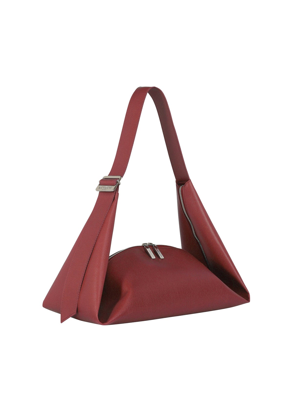 The LEAF by GOOD GOODS ISSEY MIYAKE is a red geometric cross-body bag with a structured angular shape, zip closure, and wide suede-like strap, shown against a white background. view 4 of 9