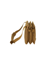Side view of the JABARA shoulder bag by GOOD GOODS ISSEY MIYAKE, featuring a tan color, adjustable shoulder strap, and three accordion pleat compartments, isolated on a white background.