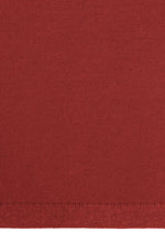 A close-up of HaaT's 3D△ KNIT in red, crafted from a wool blend. The knit texture and the straight, neatly finished hem are clearly visible at the bottom edge.