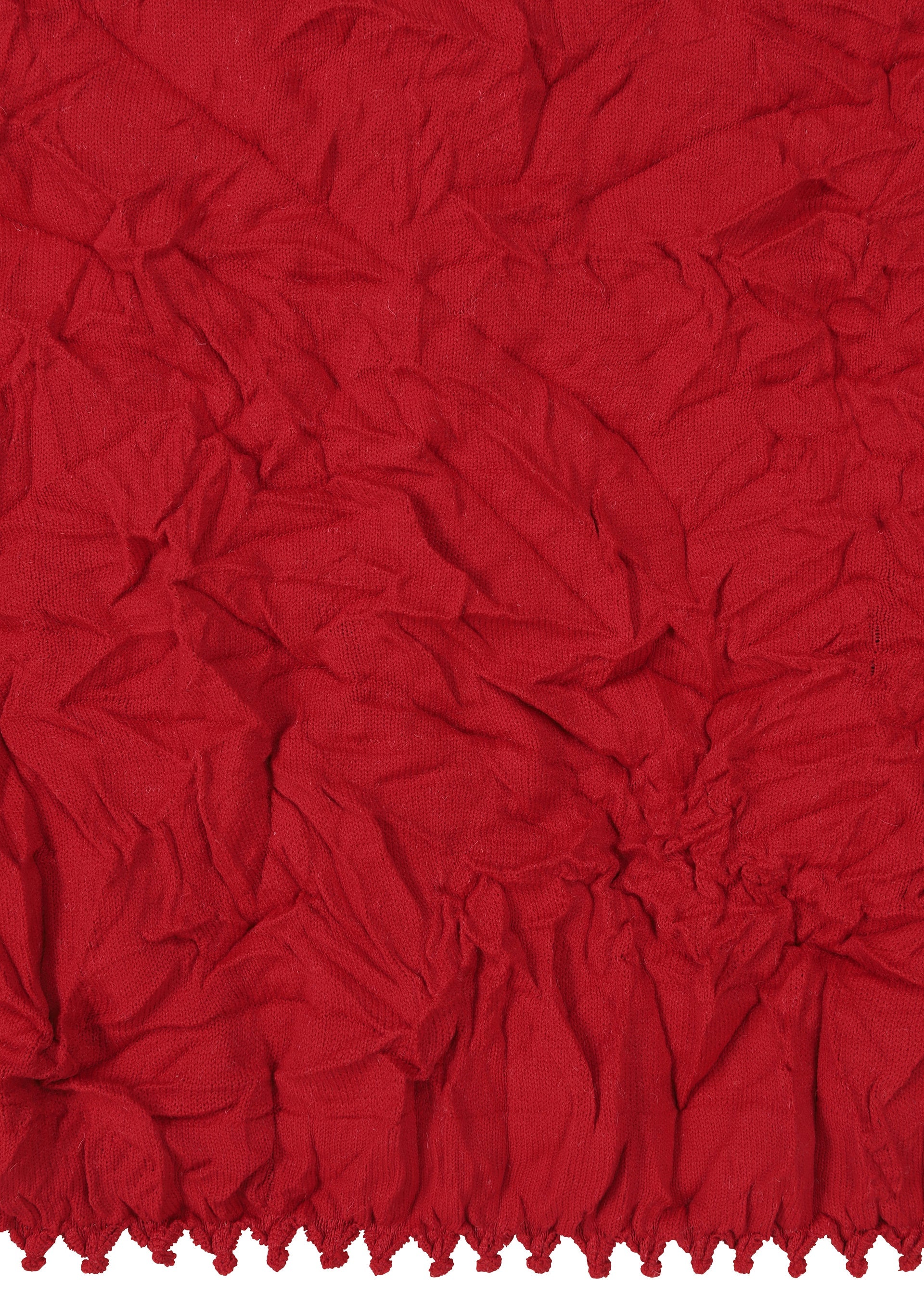 Zoomed view The KUMO SHIBORI KNIT by HaaT features crumpled red recycled polyester with a textured surface and gathered, ruffled hem, inspired by Kumo Shibori techniques.