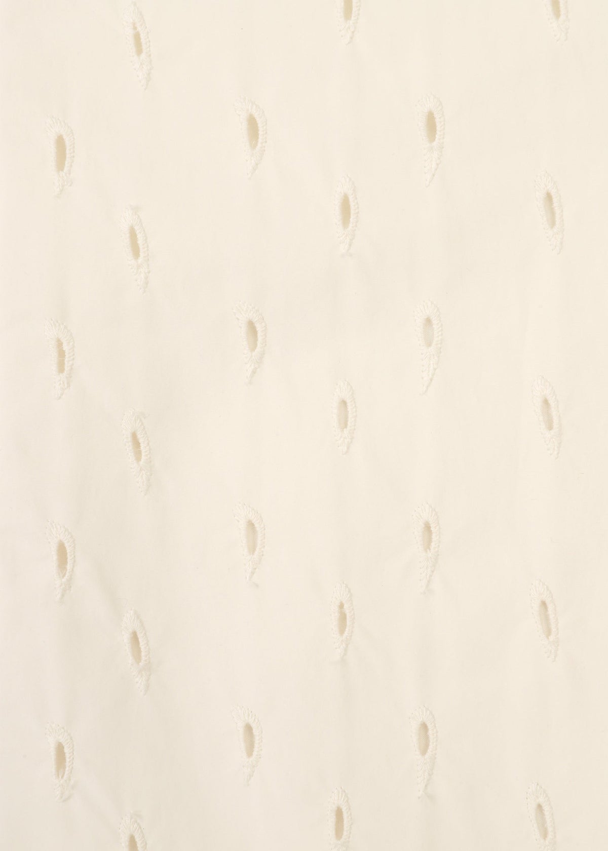Close-up of TOBIKANNA fabric by HaaT, featuring off-white material with evenly spaced teardrop-shaped eyelet holes in a subtle pattern, creating a delicate and textured look reminiscent of embroidered jacket details. view 6 of 11