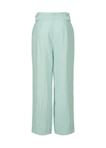 The JIKI pants by HaaT are light blue, high-waisted, wide-leg trousers crafted from soft French linen. Featuring a loose fit, subtle seam details, and a plain waistband, they offer an elegant and breathable silhouette.