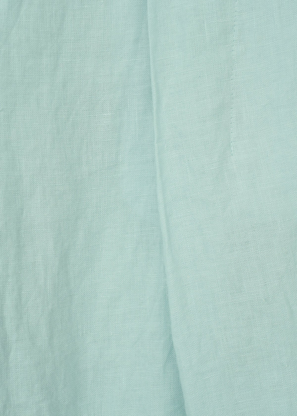 Close-up of JIKI by HaaT: light blue French linen fabric with visible weave texture and soft folds, ideal for making breathable pants. view 5 of 8