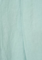 Close-up of JIKI by HaaT: light blue French linen fabric with visible weave texture and soft folds, ideal for making breathable pants.