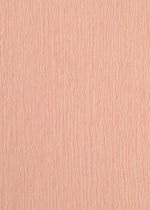 Close-up of KYO CHIJIMI FEBRUARY by HaaT: a peach-toned surface with vertical, irregular wavy lines and ultra-fine cotton-like texture, showcasing delicate craftsmanship inspired by a unique loom.