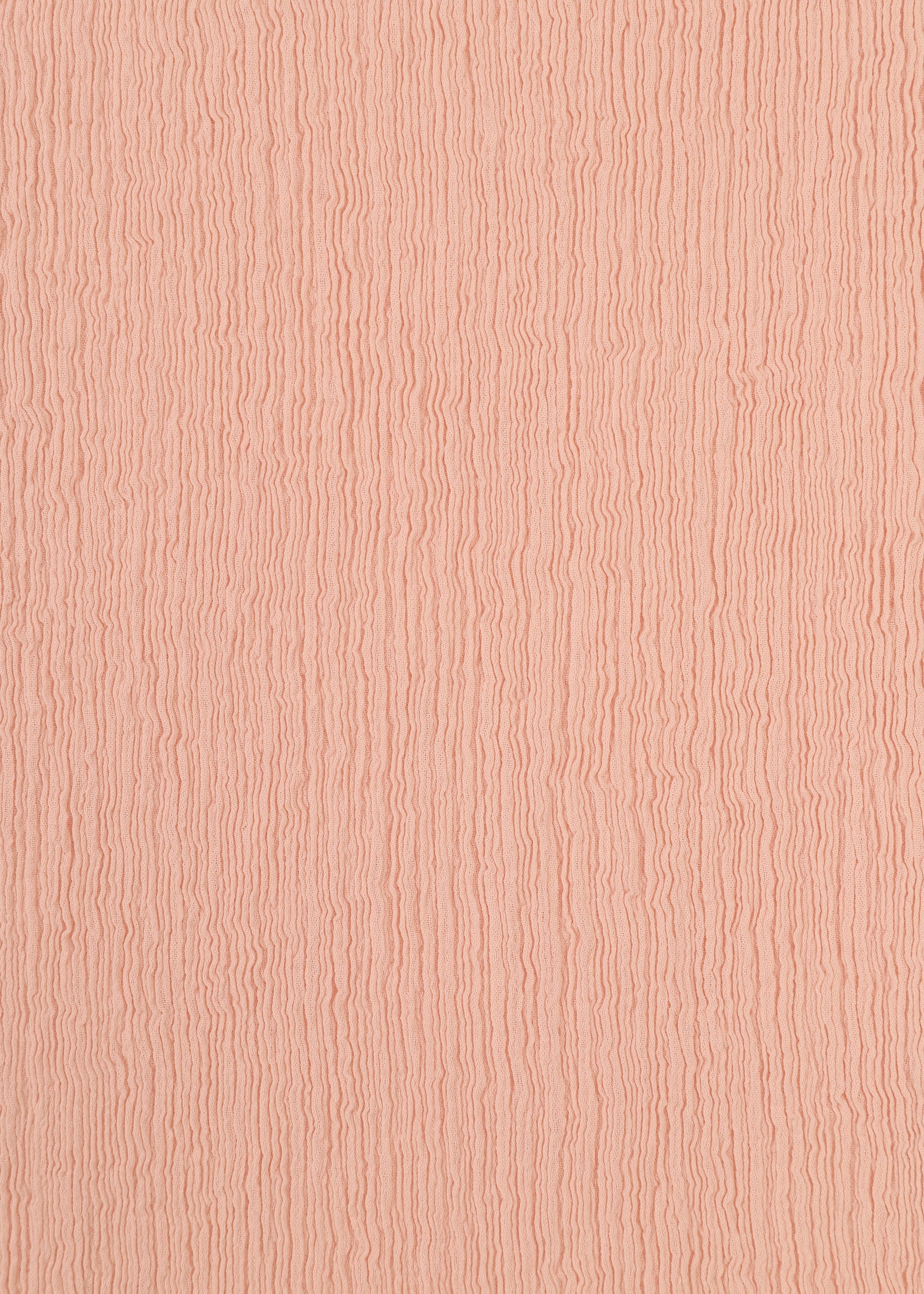 Zoomed view Close-up of KYO CHIJIMI FEBRUARY by HaaT: a peach-toned surface with vertical, irregular wavy lines and ultra-fine cotton-like texture, showcasing delicate craftsmanship inspired by a unique loom.