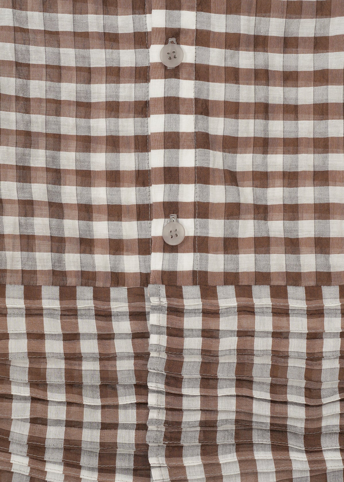 Close-up of HaaT's 2 SIDE PINTUCKING dress featuring a brown and white gingham pattern, vertical buttons, and horizontal pleats at the hem for a stylish contrast between smooth and pleated textures. view 5 of 8