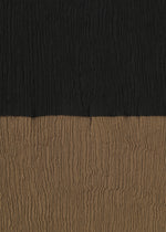 The HaaT KYO CHIJIMI STREAM features textured fabric with horizontal, crinkled lines and two-tone color blocking: black on the upper half and brown on the lower half.