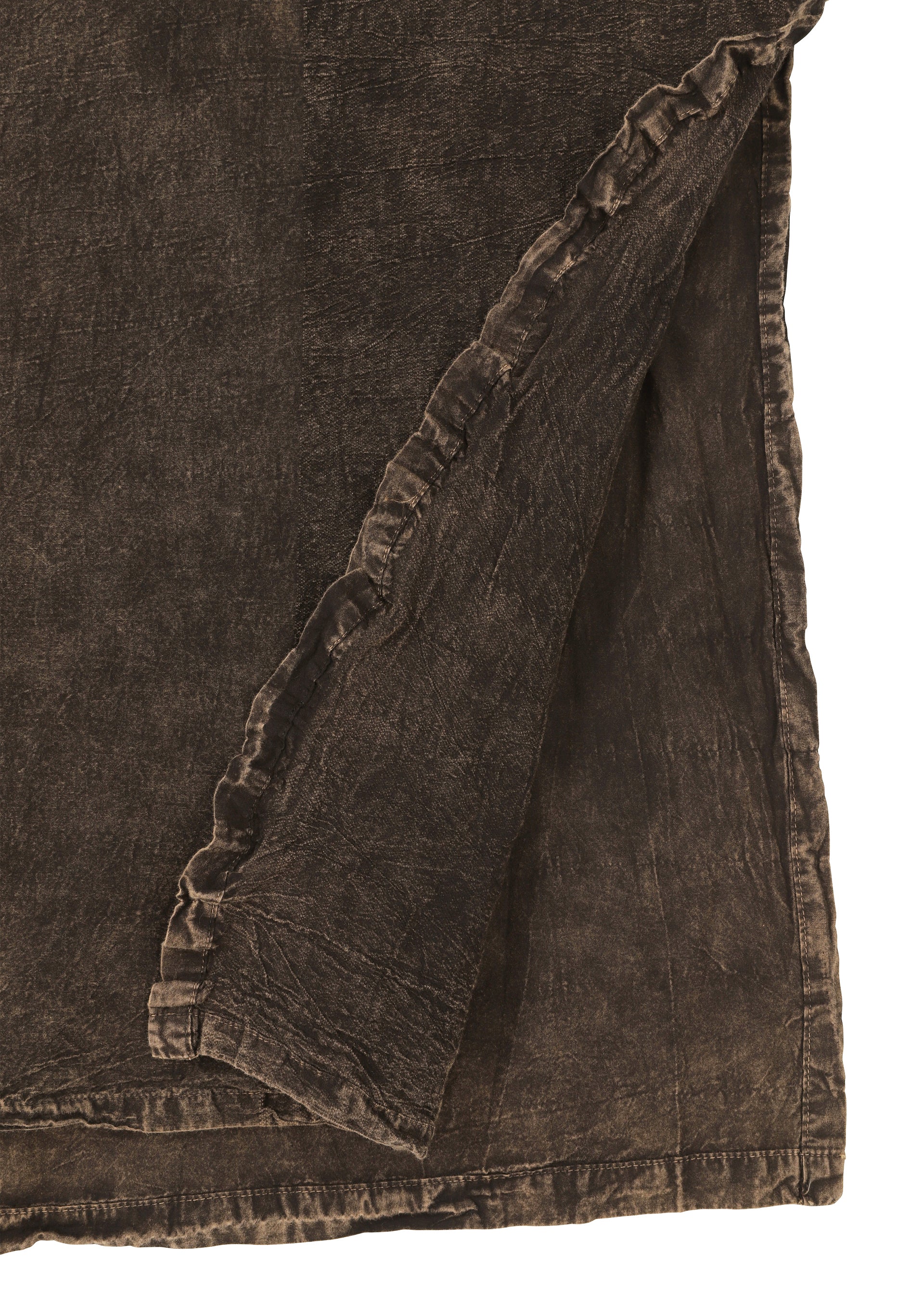 Zoomed view Close-up of HaaT’s TENMOKU COTTON: a dark brown, garment-dyed fabric with visible stitched seam and a folded corner, highlighting the material’s thickness, subtle color variations, and textured finish.