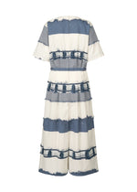 The KASANEGAKE midi dress by HaaT features short sleeves, a fitted waist, and wide horizontal blue and white stripes with frayed edges. The textured fabric adds dimension. Shown from the back.