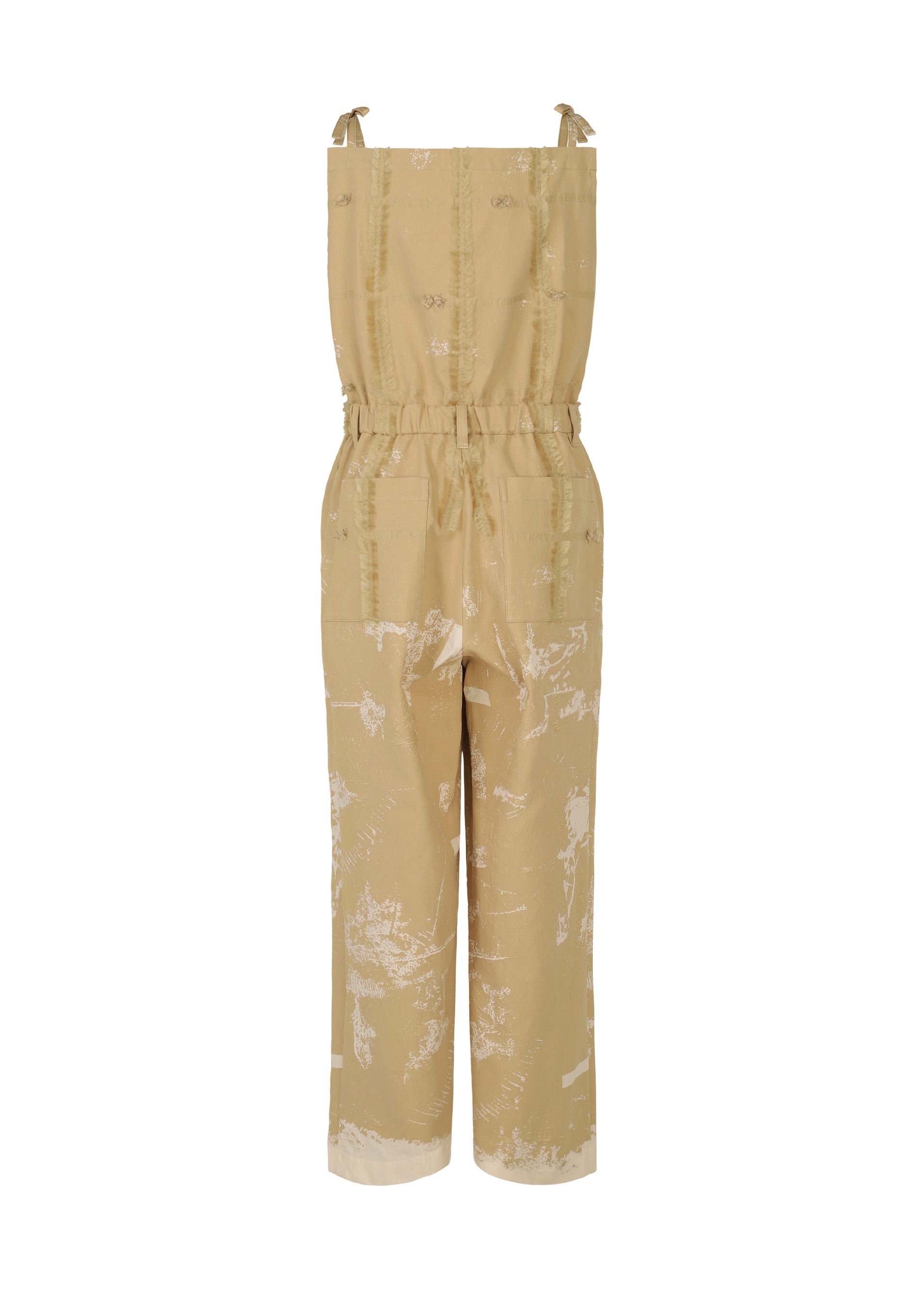 Zoomed view The KOKUYU by HaaT is a tan sleeveless jacquard jumpsuit featuring adjustable shoulder ties, a cinched waist, wide legs, and an abstract white print that adds dimension to this chic piece. Shown on a plain white background.
