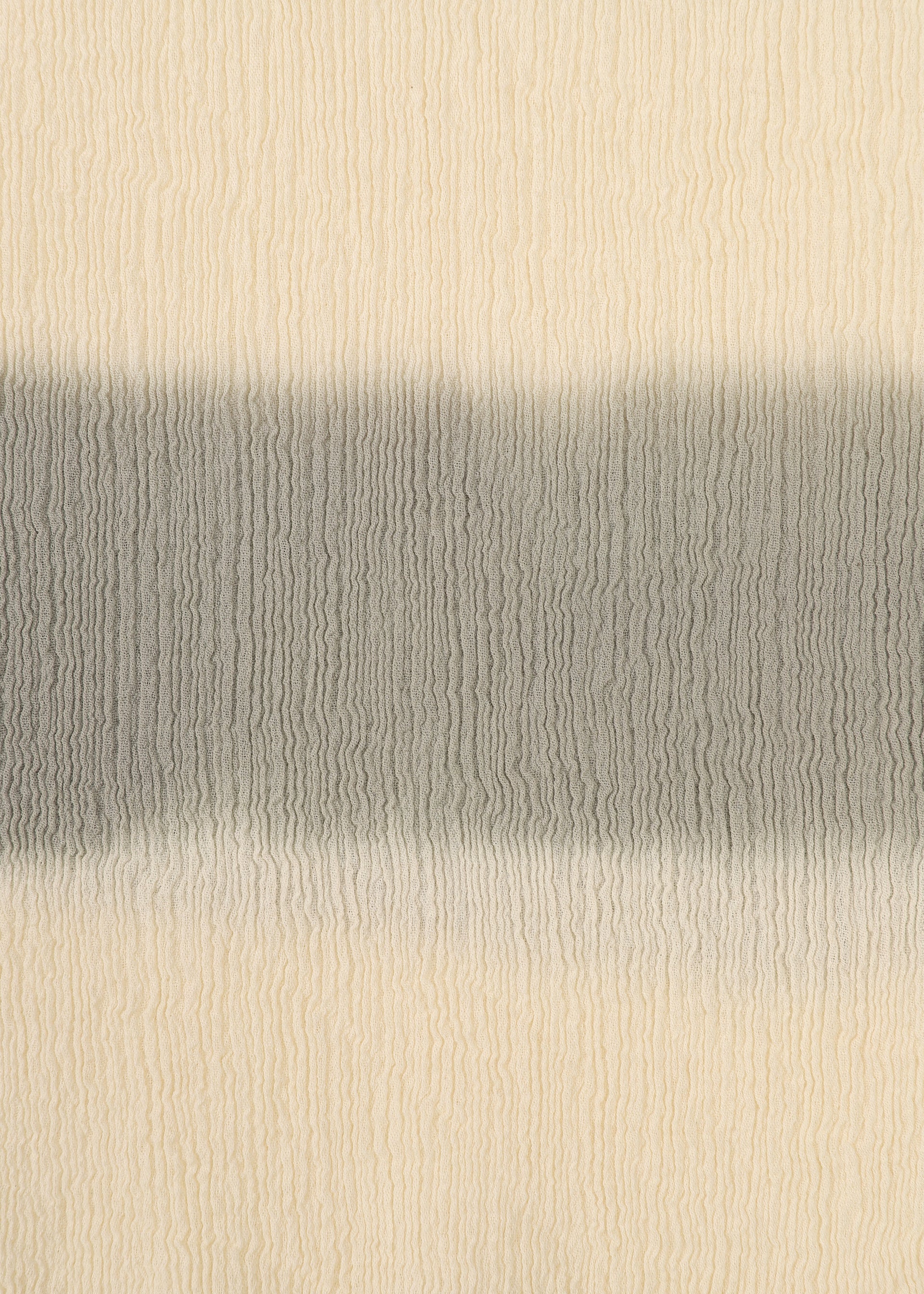 Zoomed view The HaaT KYO CHIJIMI ITAJIME features a textured beige surface with a wide horizontal gray stripe. Wavy ridges evoke the organic look of traditional Itajime dyeing techniques.