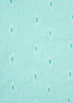 Light turquoise surface with a wavy, textured pattern and small oval indentations evokes Tobikanna embroidery or stylized ostrich leather, as seen on the HaaT KYO CHIJIMI TOBIKANNA CADEAU short-sleeve top.