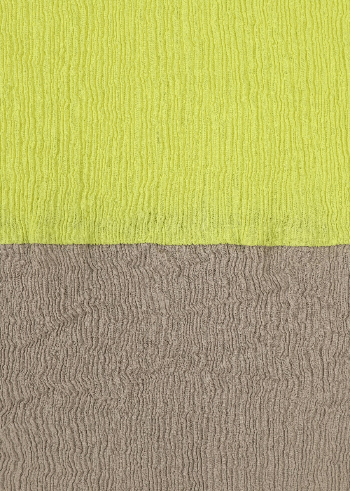 The top half of HaaT’s KYO CHIJIMI STREAM shows a bright yellow, lightweight textured surface, while the bottom is gray; both feature wavy, crinkled patterns inspired by traditional KYO CHIJIMI fabric. view 3 of 6