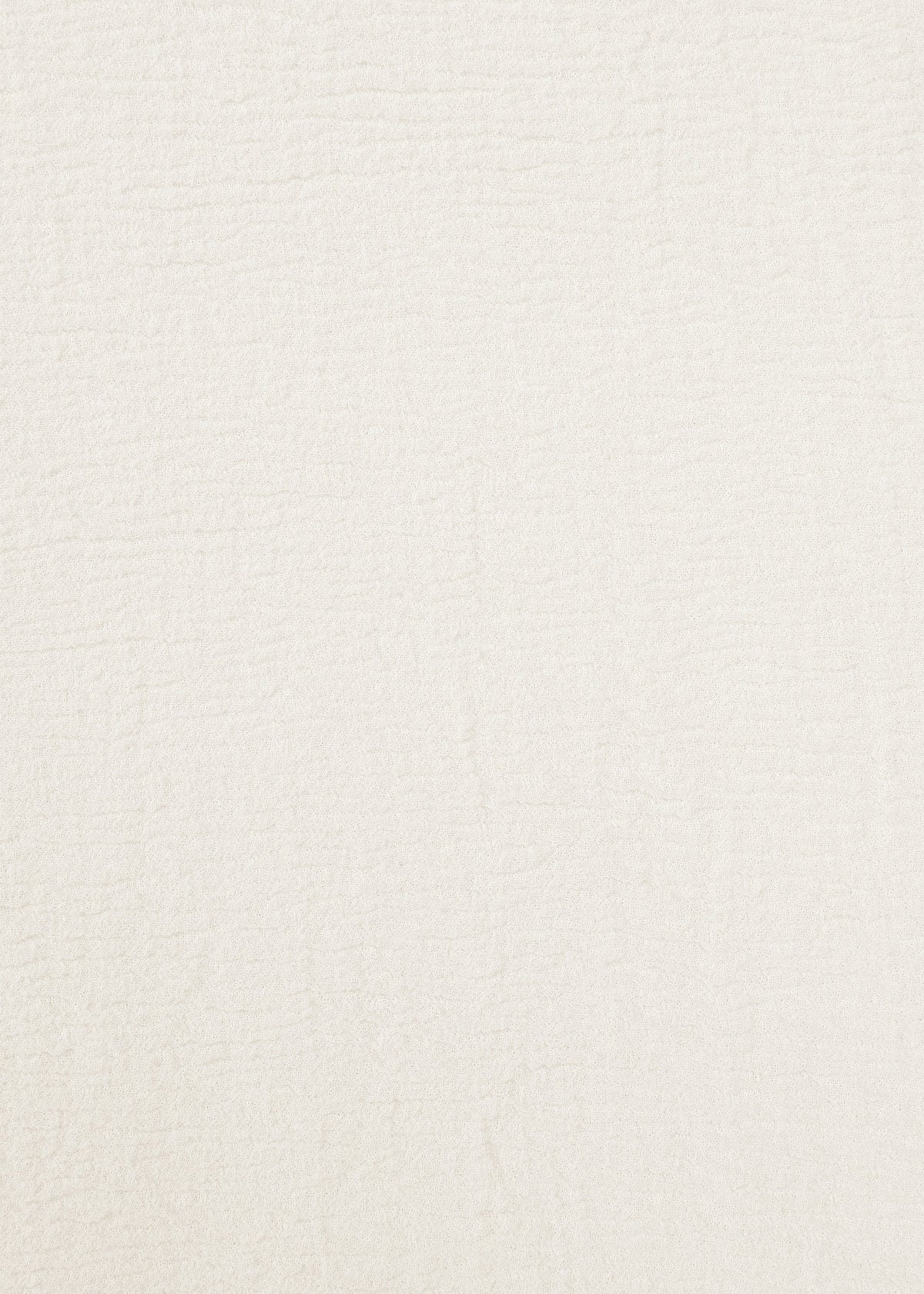 A close-up of the textured, off-white surface of HaaT’s KYO CHIJIMI 2WAY JUNE 1, featuring subtle, irregular lines and patterns that highlight its hard-twist yarn and natural finish. view 4 of 7