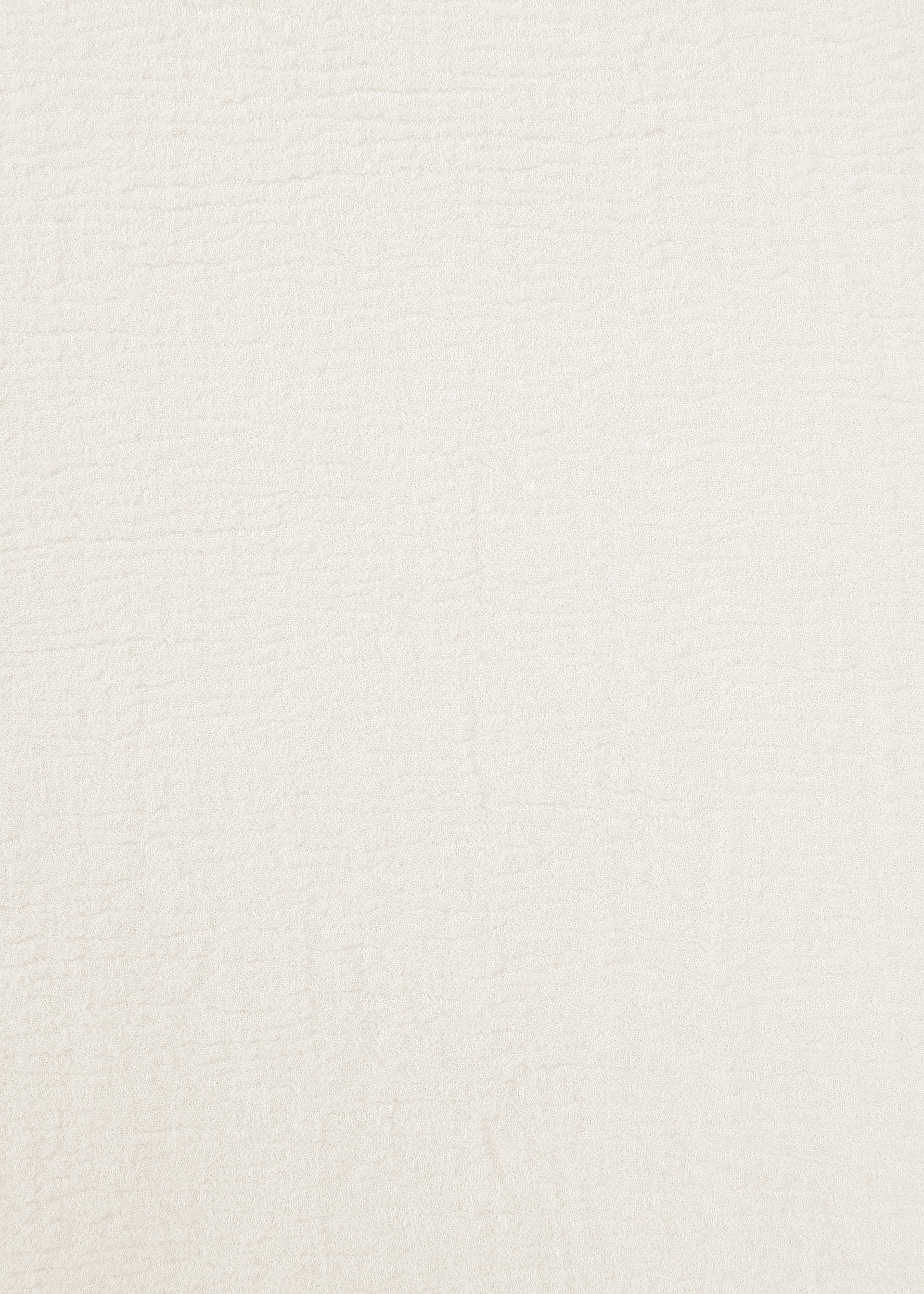 Zoomed view A close-up of the textured, off-white surface of HaaT’s KYO CHIJIMI 2WAY JUNE 1, featuring subtle, irregular lines and patterns that highlight its hard-twist yarn and natural finish.