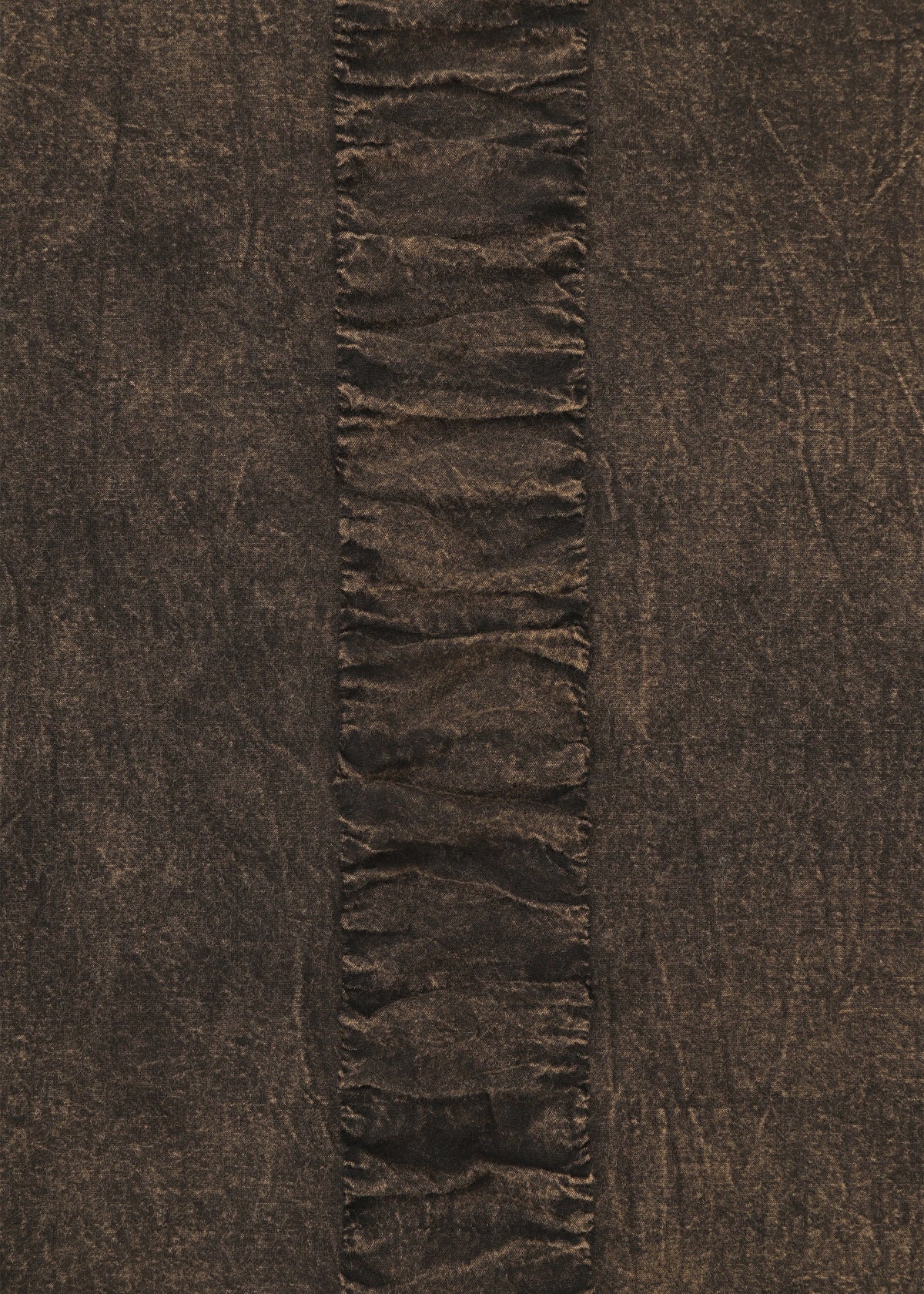 TENMOKU COTTON by HaaT features a textured brown, garment-dyed fabric with a vertical ruffled strip and gathered folds against a smooth background—ideal for creating a distinctive long-sleeved top. view 4 of 7