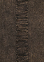 TENMOKU COTTON by HaaT features a textured brown, garment-dyed fabric with a vertical ruffled strip and gathered folds against a smooth background—ideal for creating a distinctive long-sleeved top.