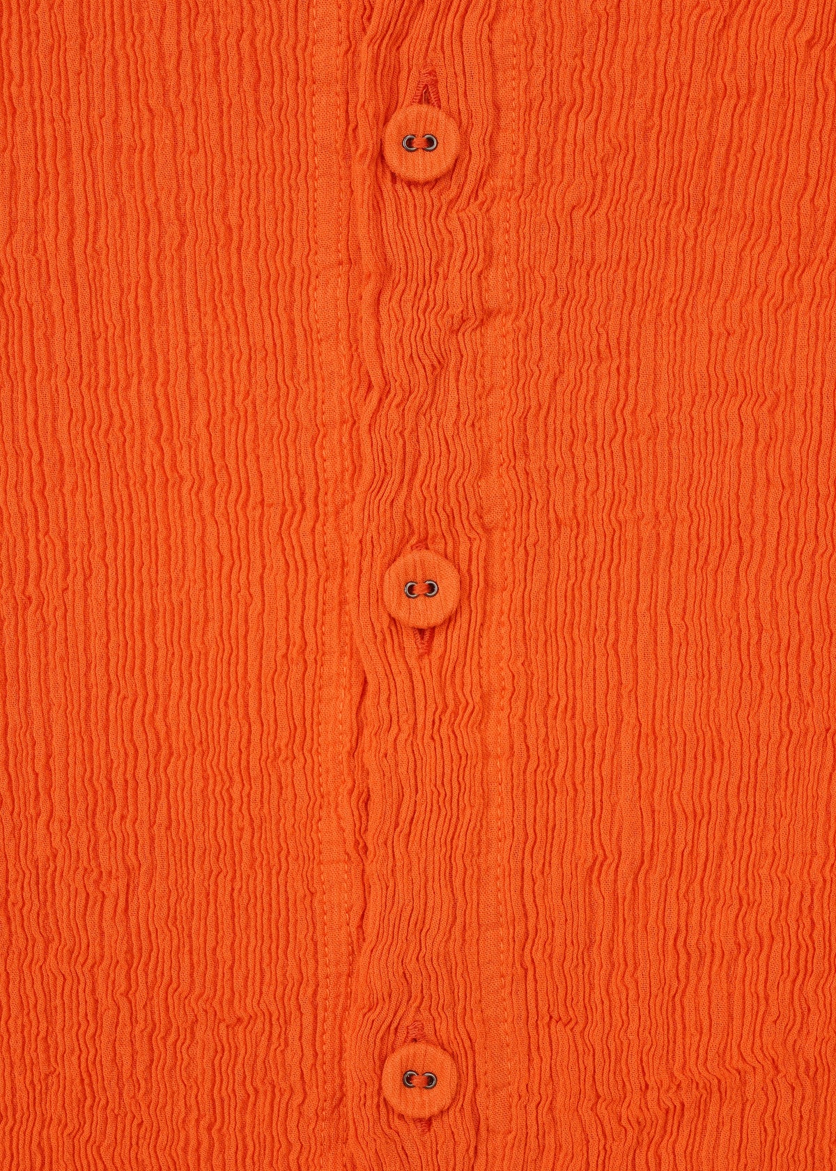 Close-up of the orange KYO CHIJIMI MAY cardigan by HaaT, crafted from ultra-fine cotton yarn with four matching buttons, a round neck, long sleeves, wavy textured fabric, and visible stitching. view 5 of 8