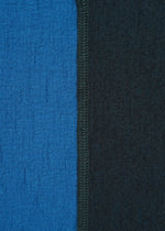 Close-up of two textured TRI COLOR WOOL jersey panels by HaaT, stitched vertically—blue on the left and black on the right—with a visible center seam.
