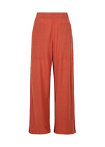 The TRI COLOR WOOL pants by HaaT feature a wide-leg, high-waisted relaxed fit in rust orange with two large front patch pockets, subtle textured fabric, and a straight hem for effortless style and comfort.