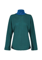 The HaaT TRI COLOR WOOL is a long-sleeve teal jacket with a high blue collar, single neck button, black side accents, and multicolor jersey details inspired by garment dyeing.