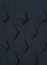 The ZIG ZAG KNIT skirt by HaaT is a dark blue, recycled polyester piece featuring a three-dimensional geometric pattern of raised diamond shapes neatly arranged across the surface.