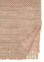 A close-up of HaaT's MELANGE MESH shows its beige organic cotton weave with varied textures and fringe along the edge. A folded corner reveals the reverse side and extra fringe details.