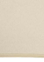 A close-up of PLATED LINES by HaaT shows a beige organic cotton fabric with a subtle woven texture and a visible stitched edge along the bottom.