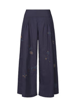 The DAMI LEAVES pants by HaaT are wide-leg, navy blue, cropped cotton trousers with a high waist and subtle handmade Indian embroidery featuring delicate floral motifs along the legs. - INDIGO （no.78）