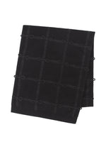 The HaaT RIBBON KNIT is a folded black fulled wool stole with a subtle grid pattern and small hand-tied ribbons at each intersection, shown on a white background. - BLACK （no.15）