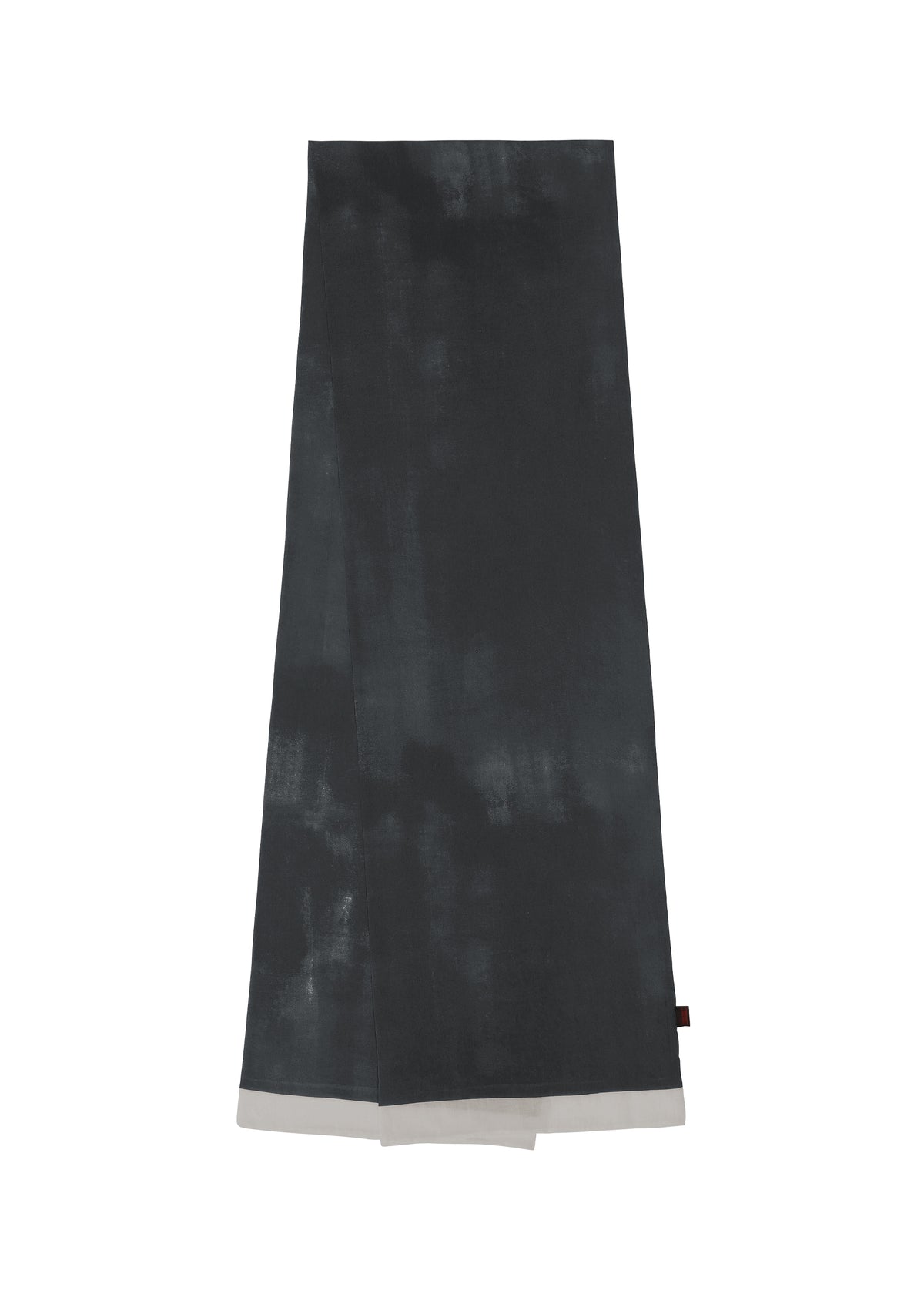 The HaaT WALL WHITE HEM is a long, dark gray chiffon stole featuring a subtle uneven Nassen print and a light gray border at one end, shown laid flat on a white background. view 1 of 8