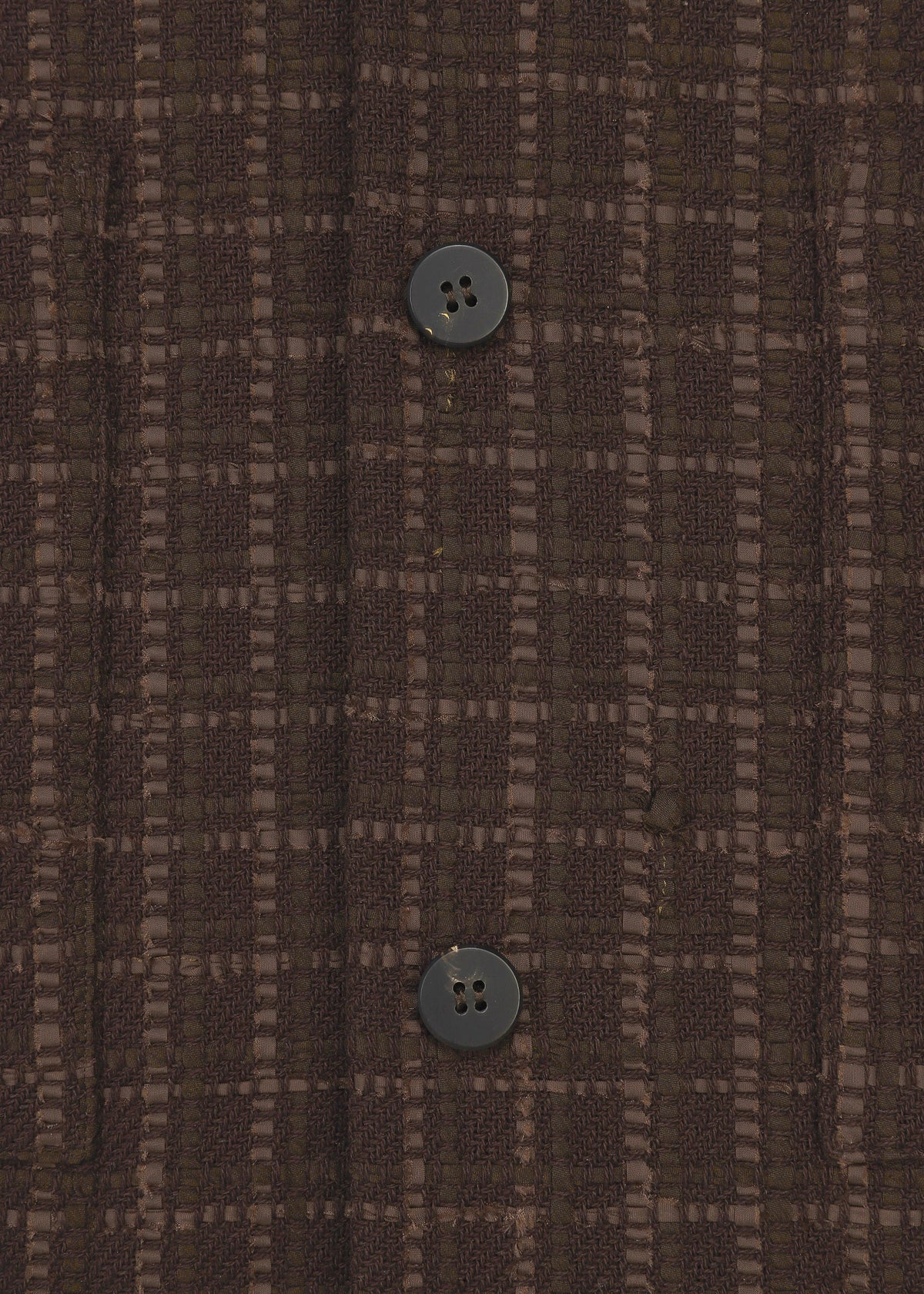 Close-up of SAKIORI by HaaT: brown textured fabric with a checkered pattern and two black buttons sewn vertically, inspired by traditional Sakiori weaving techniques. view 6 of 10