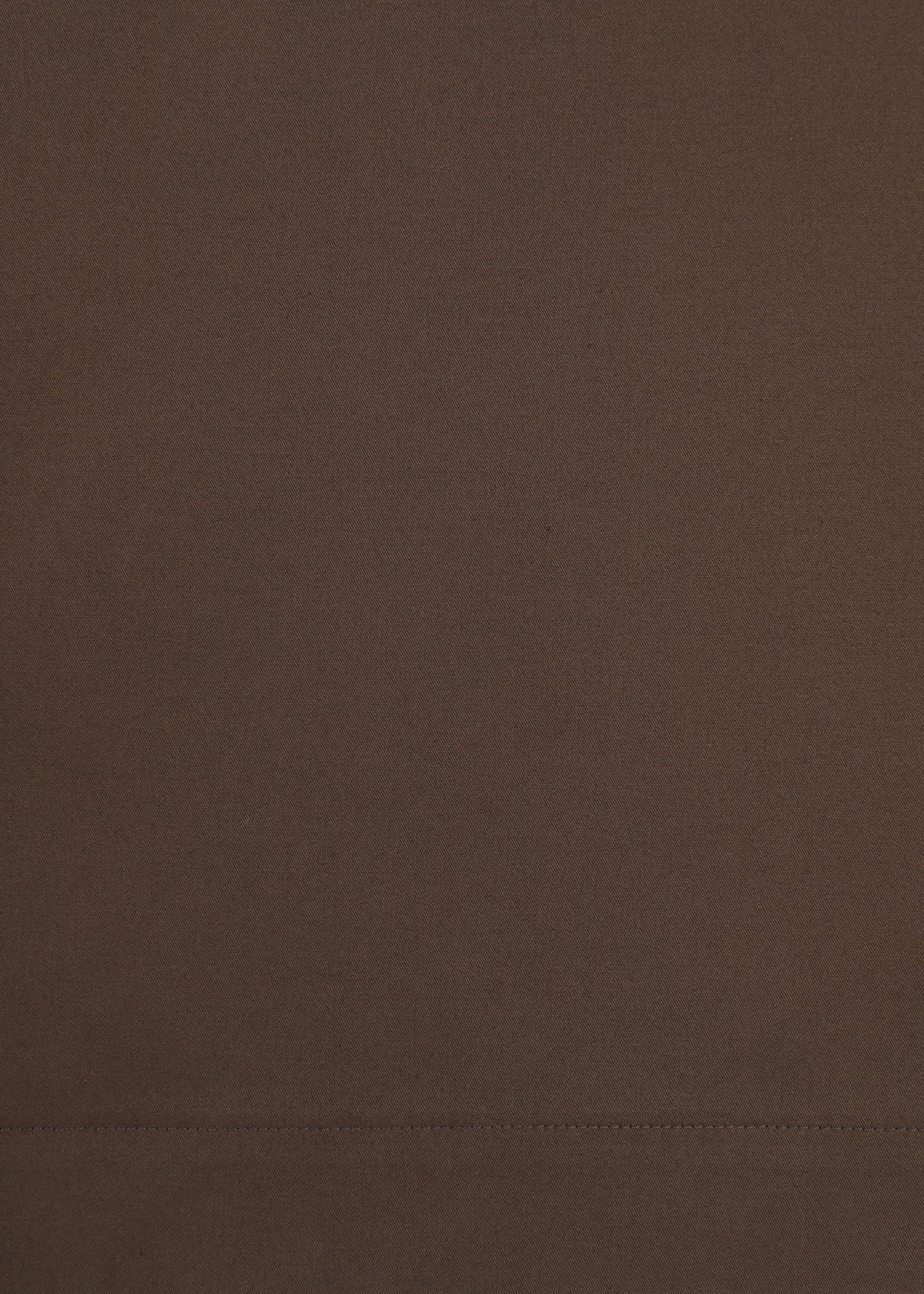 A close-up view of the smooth, brown COTTON STRETCH BOTTOM by HaaT, crafted from extra-long-staple cotton and featuring a horizontal stitched seam near the bottom of the image. view 5 of 8