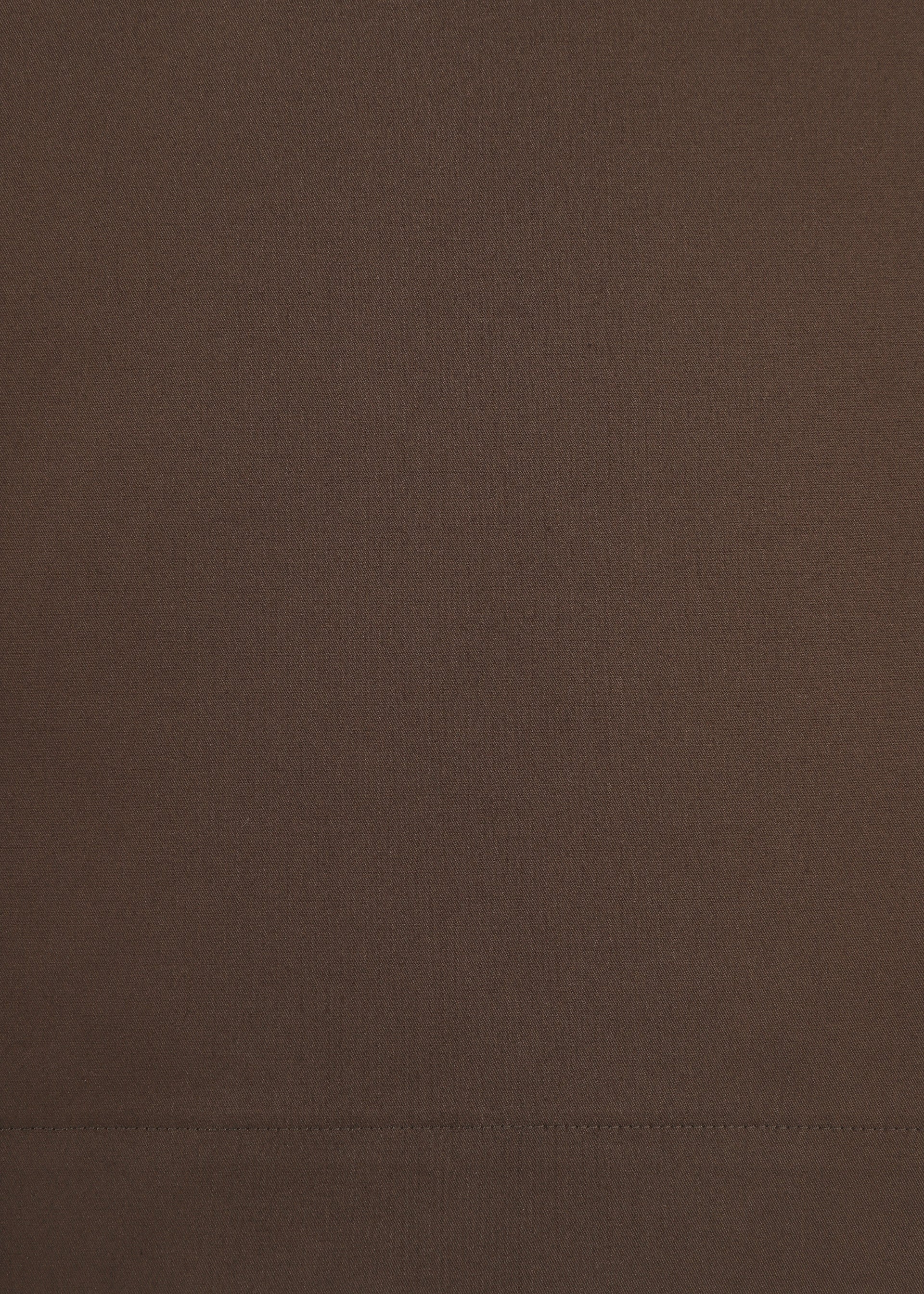 Zoomed view A close-up view of the smooth, brown COTTON STRETCH BOTTOM by HaaT, crafted from extra-long-staple cotton and featuring a horizontal stitched seam near the bottom of the image.
