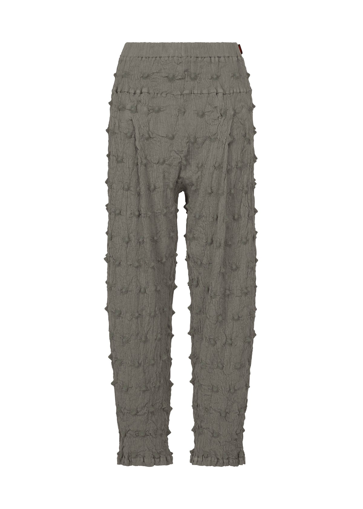 HaaT’s KYO CHIJIMI SQUARE EMB pants in gray feature a crinkled, textured fabric with raised, bumpy square embroidery throughout. Designed with an elastic waistband, these pants offer a relaxed fit and slightly tapered legs. view 1 of 9