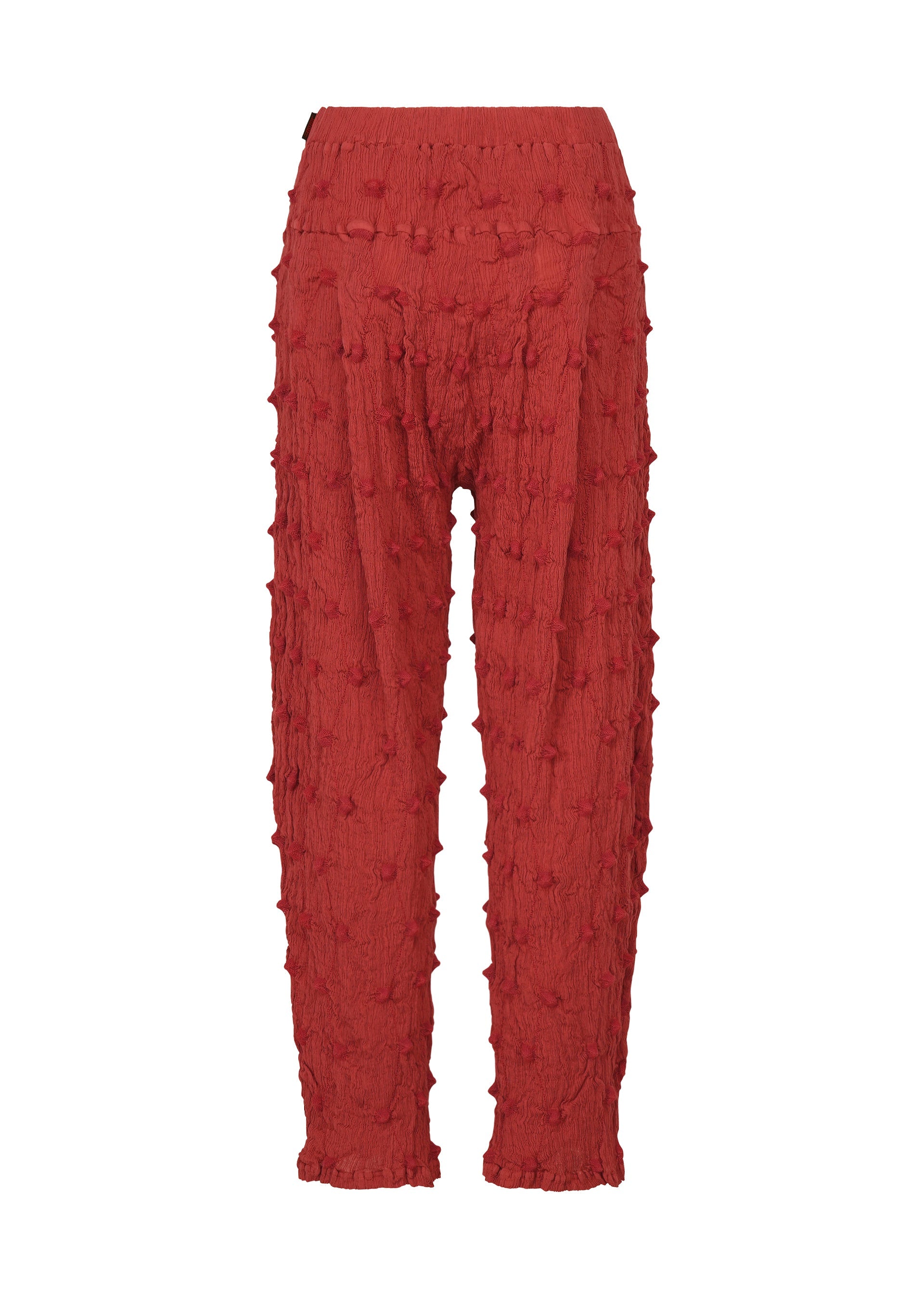 Zoomed view The KYO CHIJIMI SQUARE EMB pants by HaaT feature a striking red color with an elastic waistband, raised bumpy details across the fabric, a distinctive crinkled texture, and subtle square-pattern embroidery, all showcased on a white background.