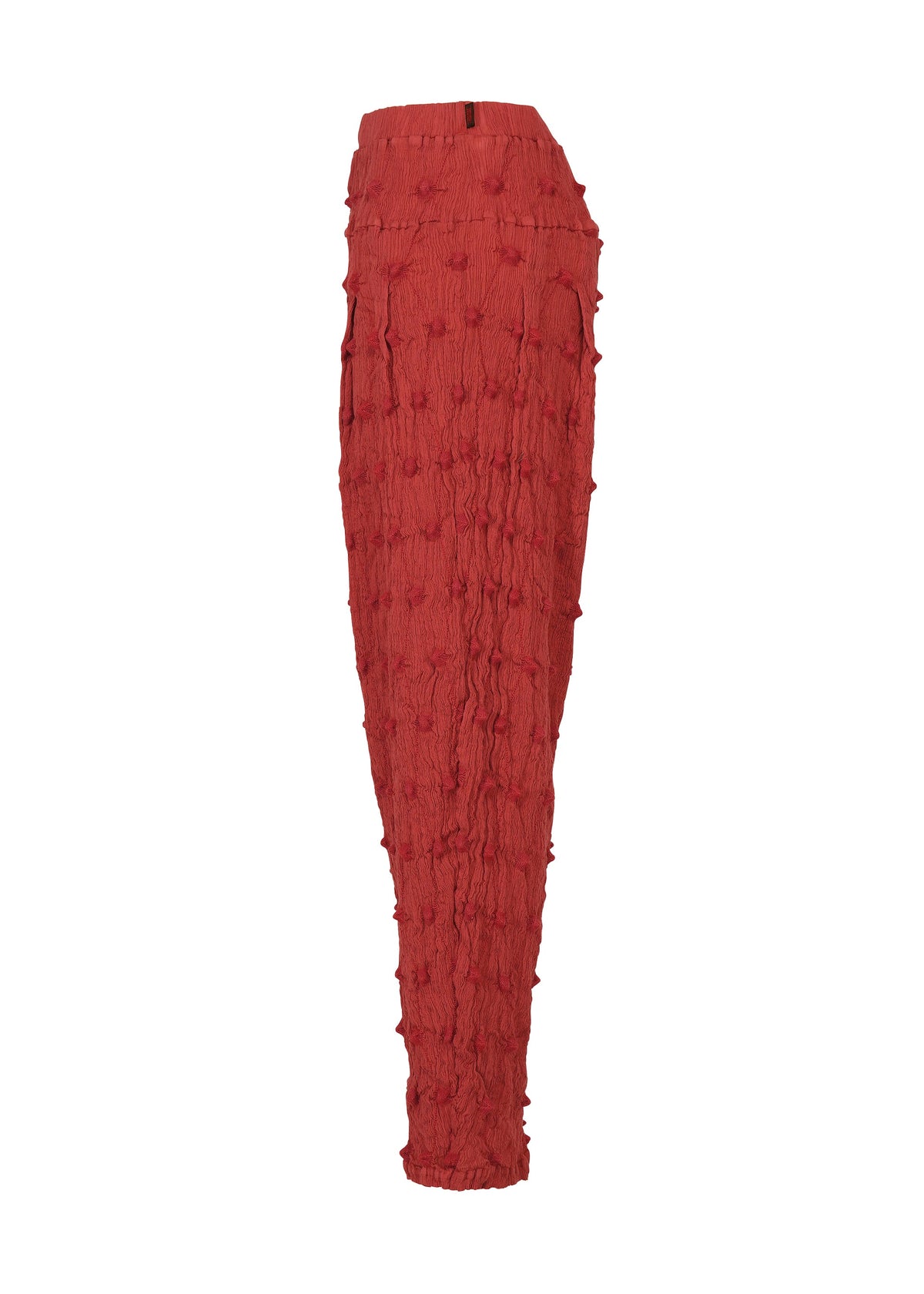 The KYO CHIJIMI SQUARE EMB pants by HaaT are high-waisted, red pants with a slightly tapered leg. They feature a distinctive crinkled texture inspired by classic KYO CHIJIMI styles and are embellished with raised dot details throughout. The pants are shown against a white background. view 5 of 9