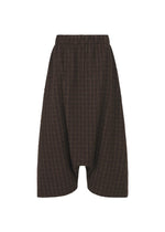 SAKIORI wide-legged brown sarouel shorts by HaaT, featuring a dropped crotch, subtle checkered woven fabric, and an elastic waistband, displayed front-facing on a plain white background. - BROWN （no.44）