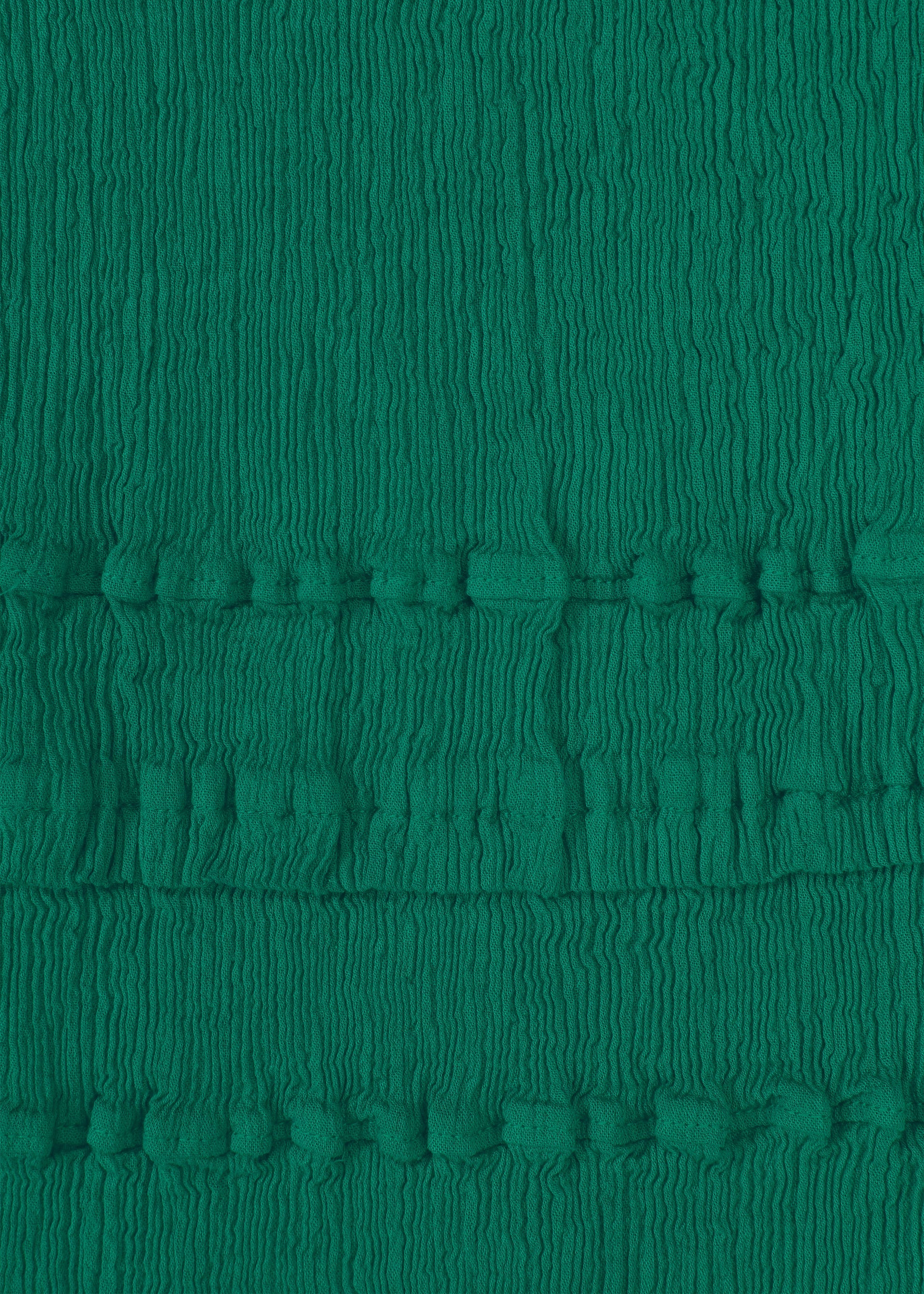 Zoomed view Close-up of green textured KYO CHIJIMI TSUCHIKABE fabric by HaaT, with vertical crinkles and two horizontal bands of small, evenly spaced raised bumps. Made from ultra-fine cotton for a crepe-like feel, reminiscent of KYO CHIJIMI pants.