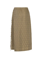 The HOLE & LINE skirt by HaaT is a knee-length, light brown twill piece featuring a textured grid-like pattern and a side tie detail. It has a simple, straight silhouette with an elastic waistband and is crafted from a soft cupra blend for comfortable all-day wear.